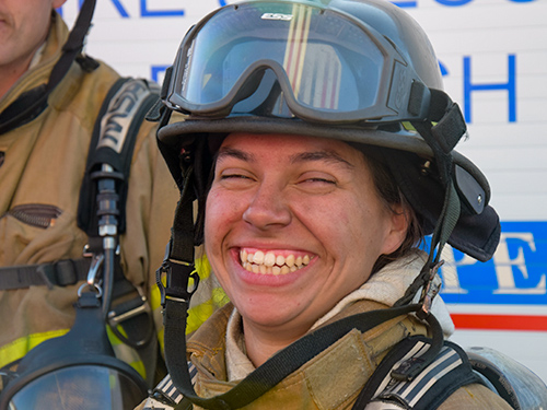 smiling woman firefighter