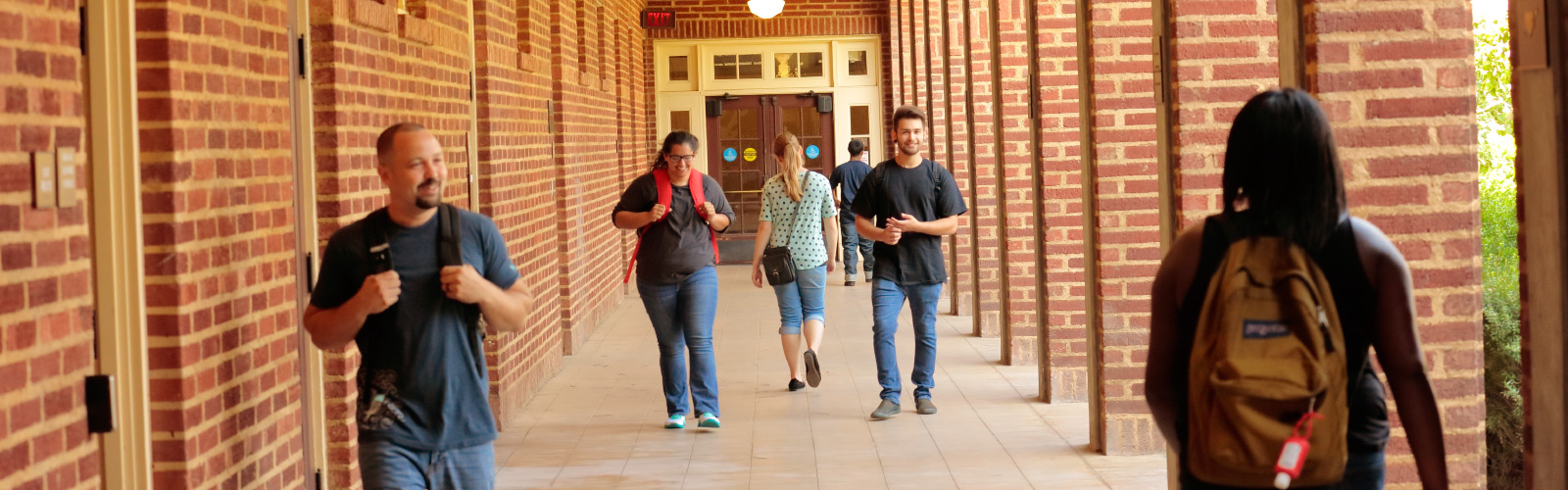 Students walking down OAB hall 