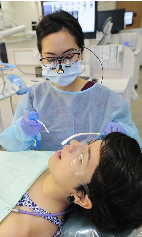 dental hygiene student giving cleaning