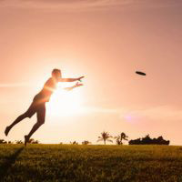 Photo of man catching frisbee