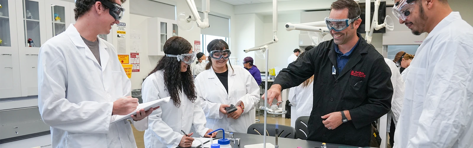 Students in lab coats 